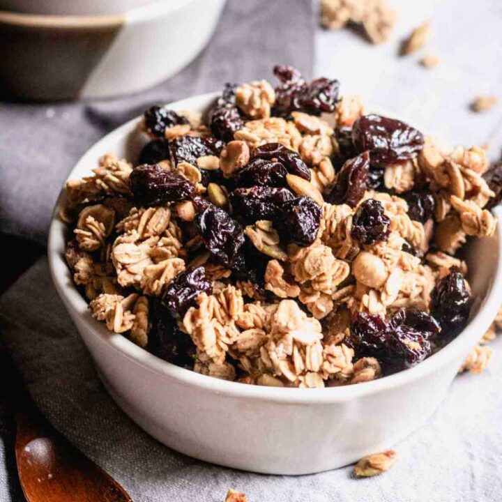PIcture of a bowl of sourdough granola with dried fruit and nuts.