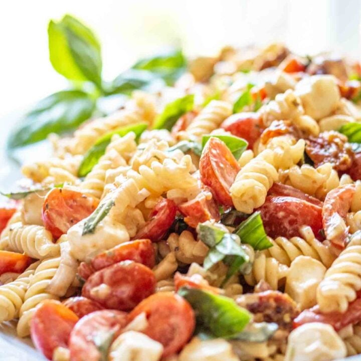 A heaping platter of caprese pasta salad.